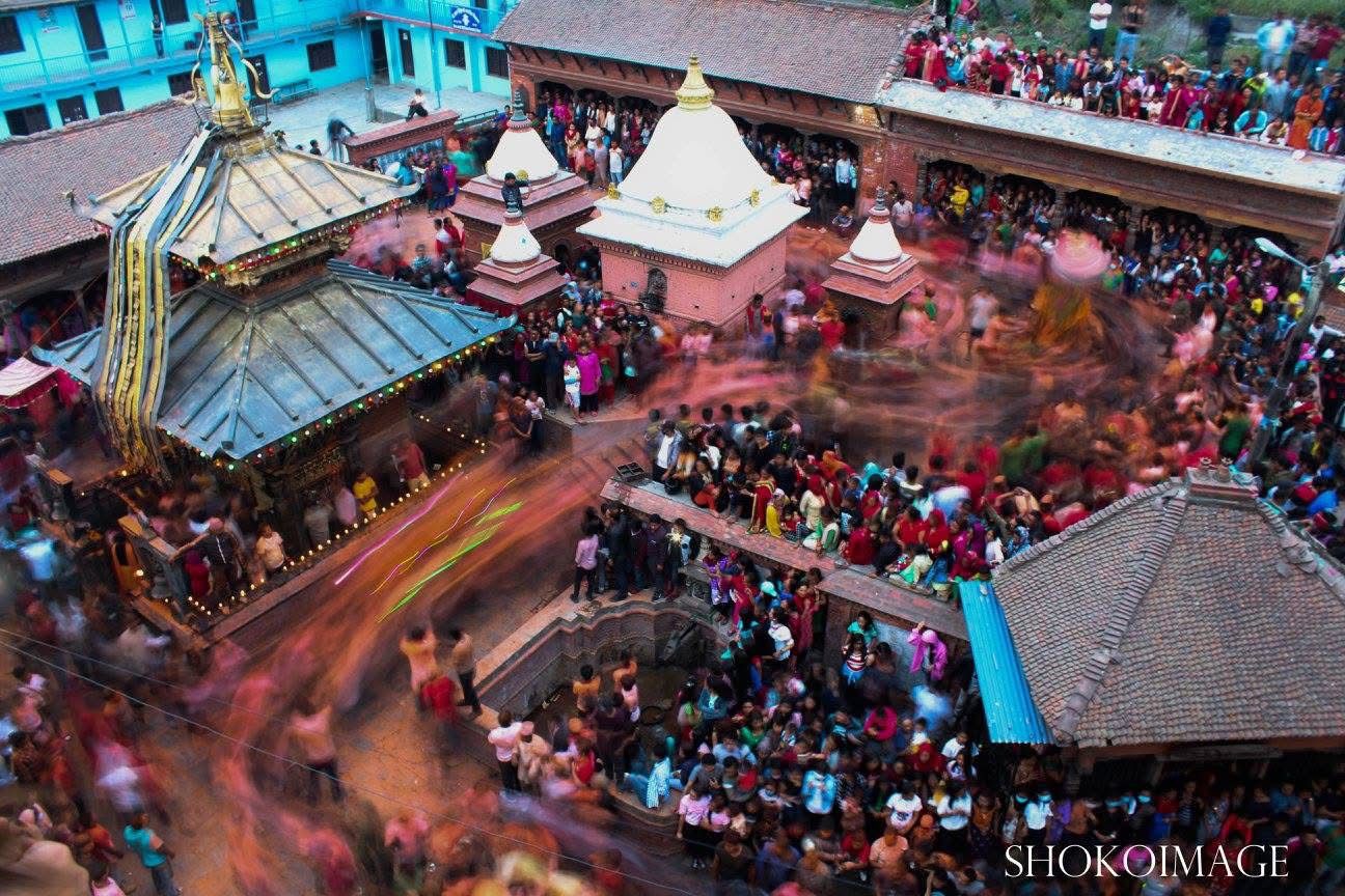 Chariot being rotated around a temple by locals during the Sinur Jatra festival in Bhaktapur, Nepal
