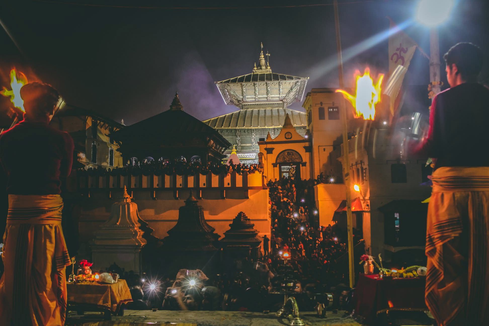 Nepal cultural experiences: Evening prayer ritual with oil lamps at Pashupatinath Temple, Kathmandu